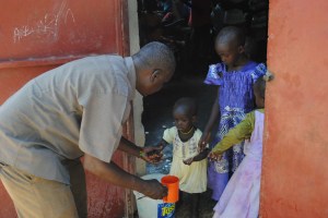 Pastor M serving the children at the feeding program in Lokichoggio....This is one of the three projects supported by the Northern Kenya Feeding Program,